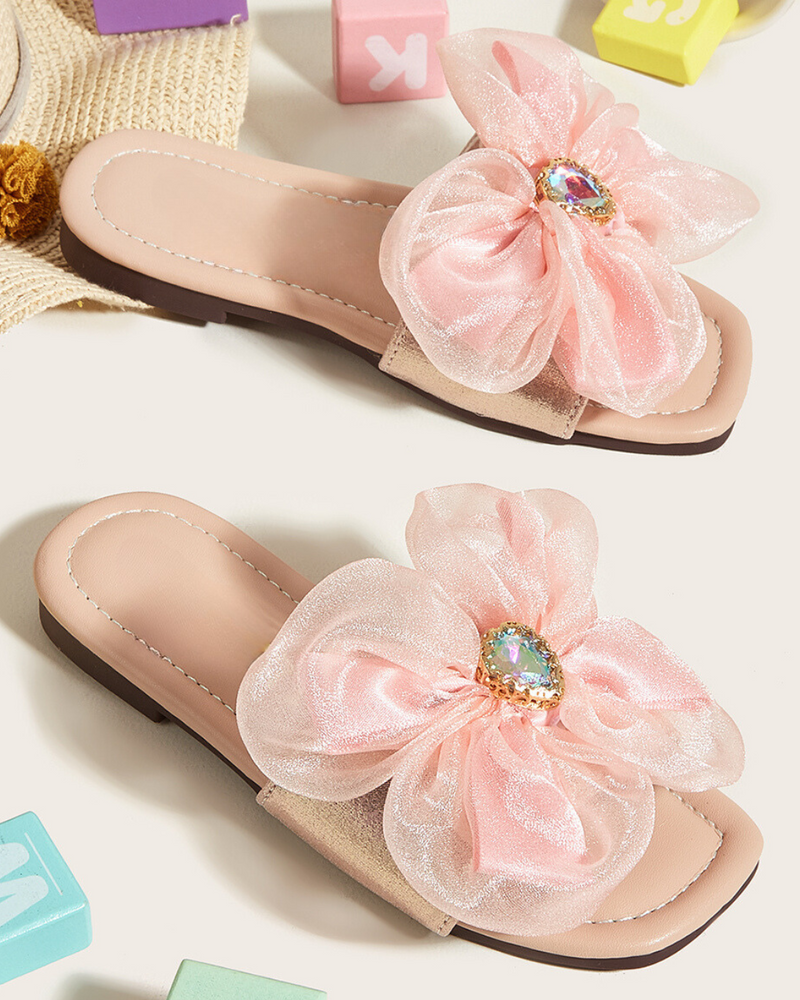 Big flower adorned pink slippers