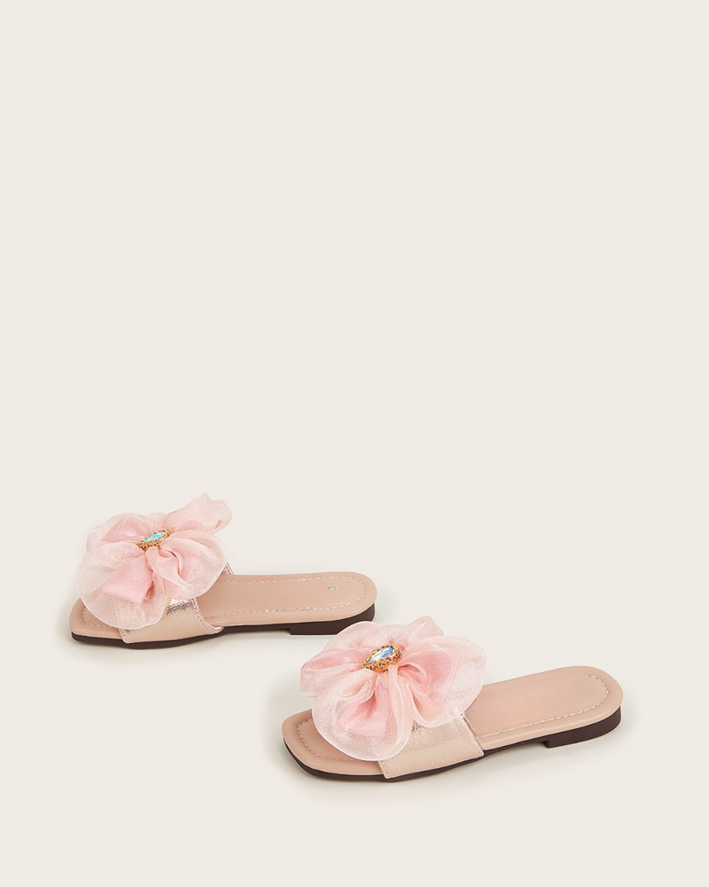 Big flower adorned pink slippers